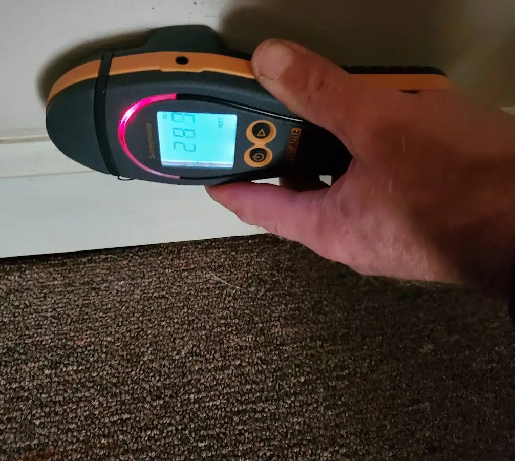Moisture detection at baseboard during Storm Damage Restoration in Beachwood